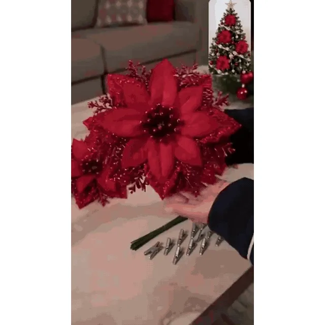 Red poinsettia clips being styled for Christmas