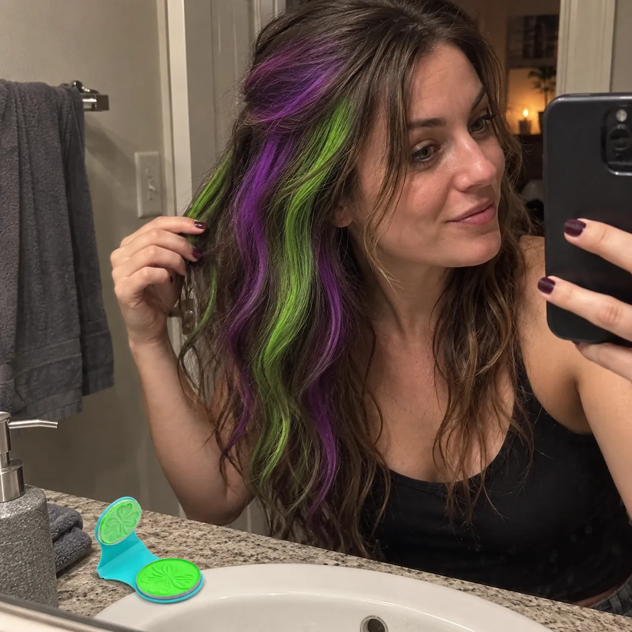 Purple and green temporary hair streaks after a costume party
