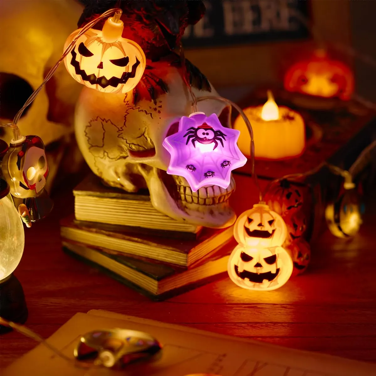 Halloween character lights displayed across a decorative wooden surface