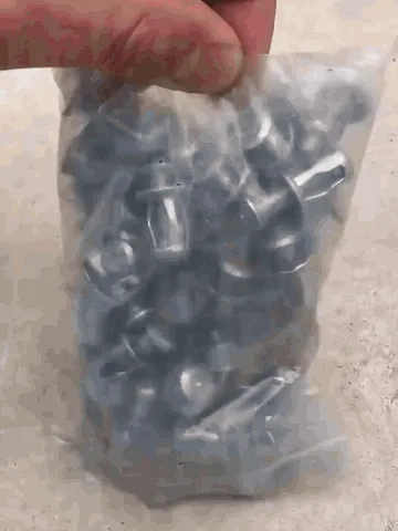Jack nut expanding behind a hollow metal wall during installation