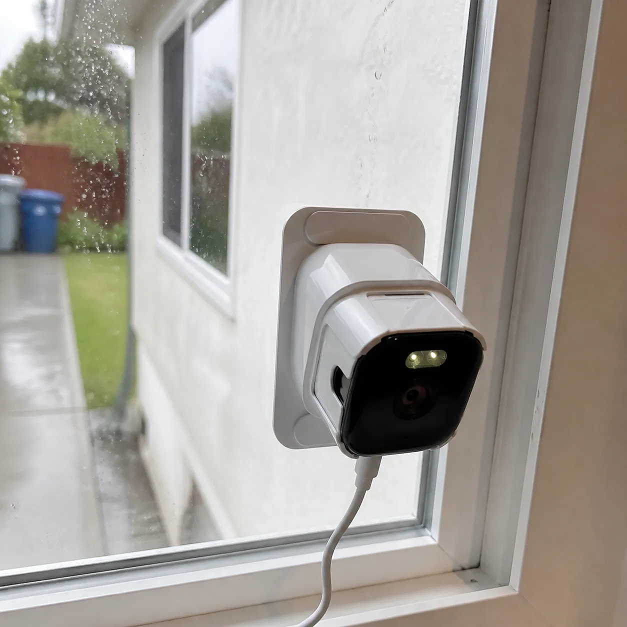 Camera on a rainy day window
