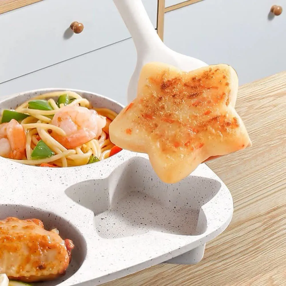Star-shaped breakfast bite lifting from the pan