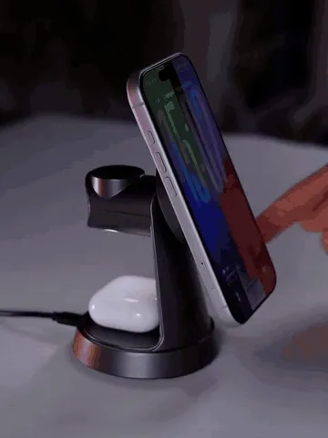 Phone, smartwatch, and wireless earbuds charging on one upright stand