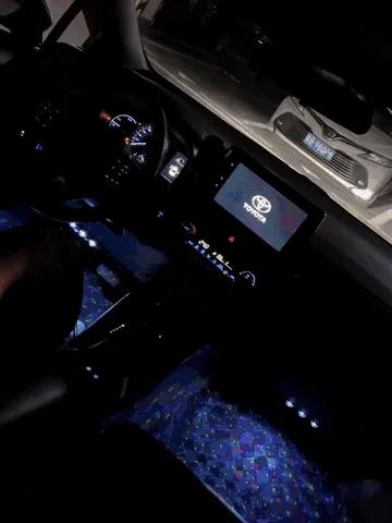 Four car footwell light bars being installed and creating a colorful star glow