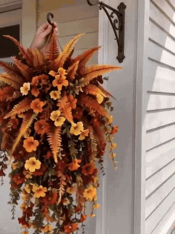 Autumn floral swag being hung and shaped on a covered porch
