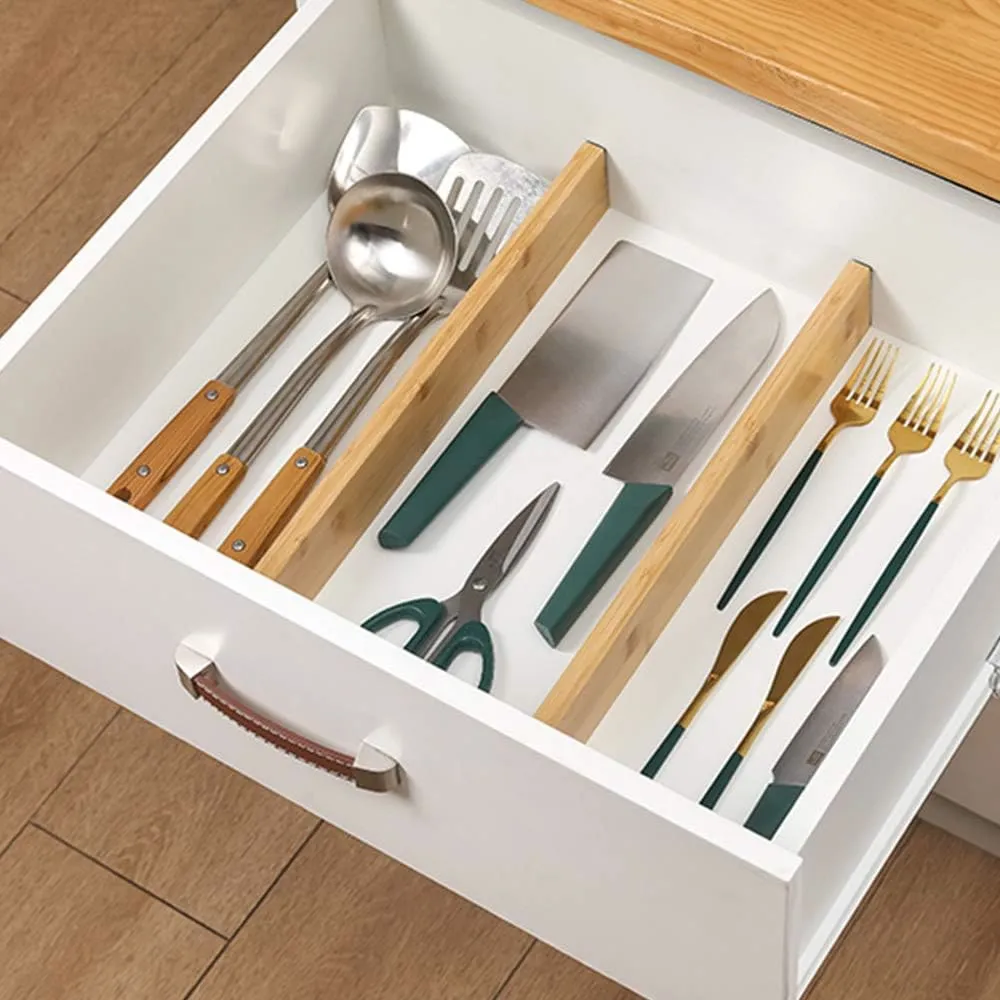 Kitchen utensils separated by natural bamboo drawer dividers