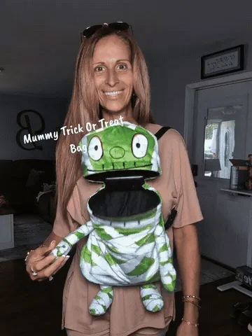 Mummy crossbody treat bag opening and worn hands-free