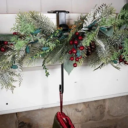Metal hanger holding greenery
