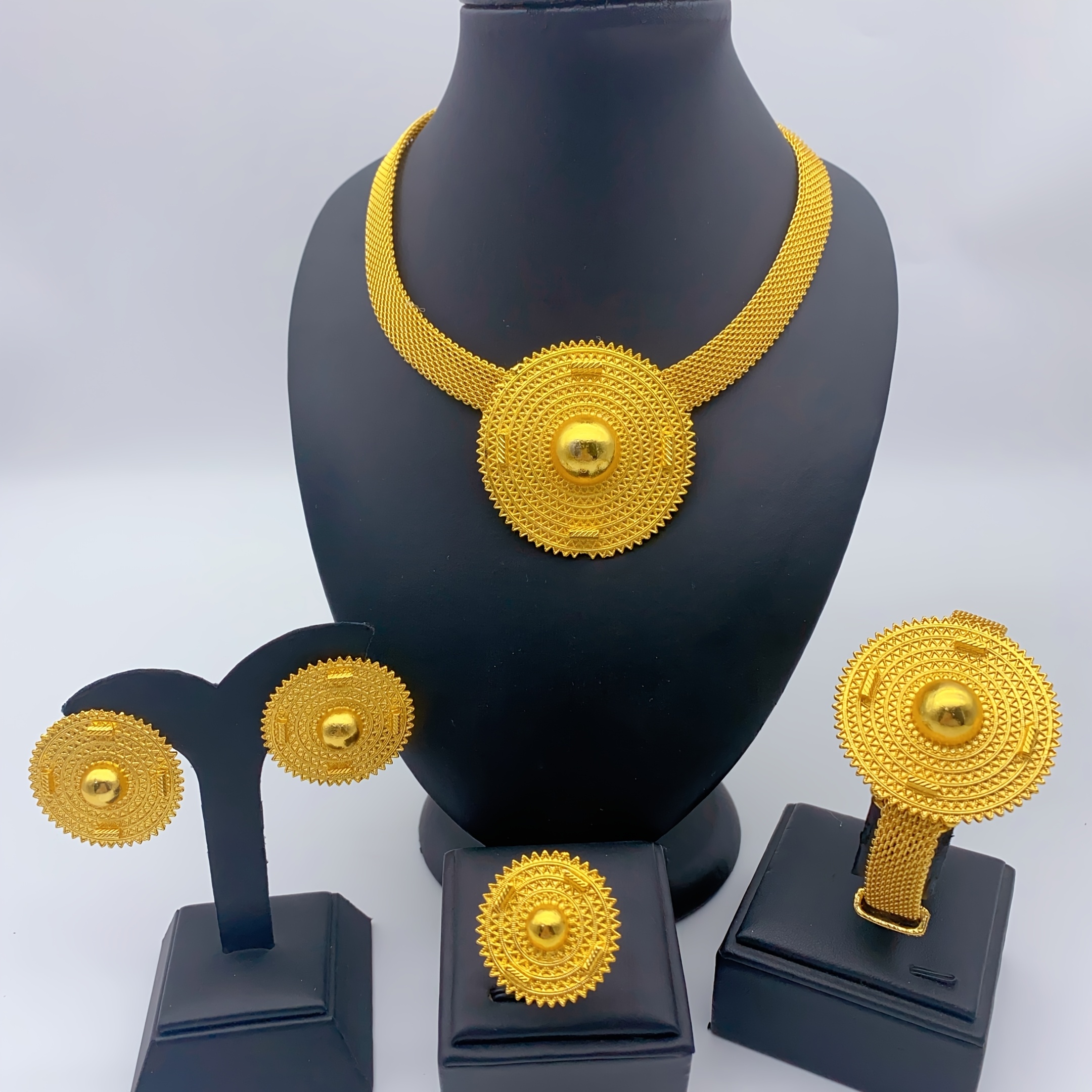 Gold-tone concentric sunburst jewelry set, front view
