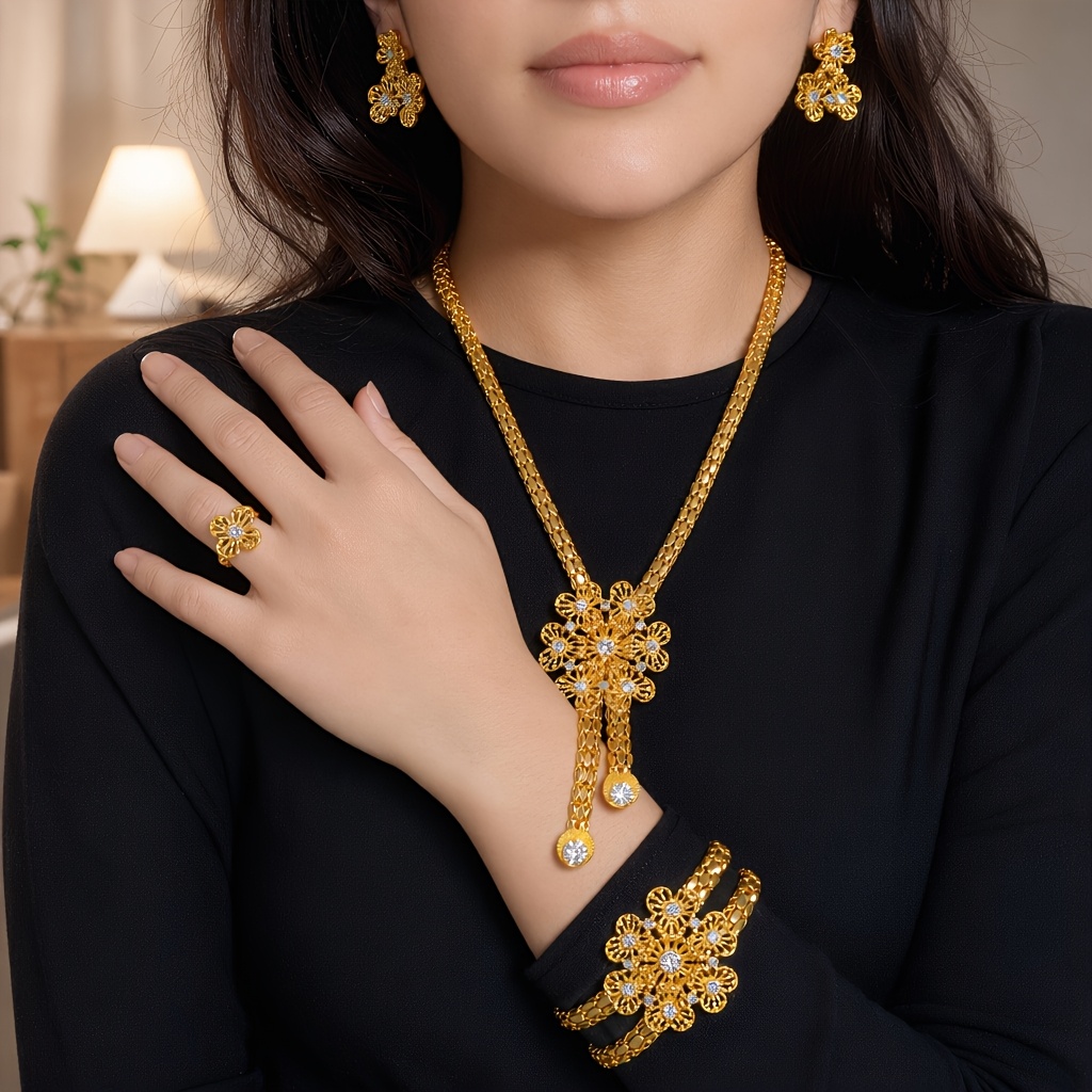 Gold-tone openwork floral tassel jewelry set, front view