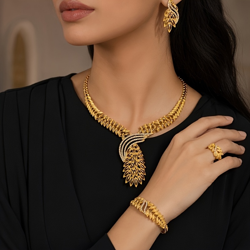Gold-tone openwork leaf jewelry set, front view