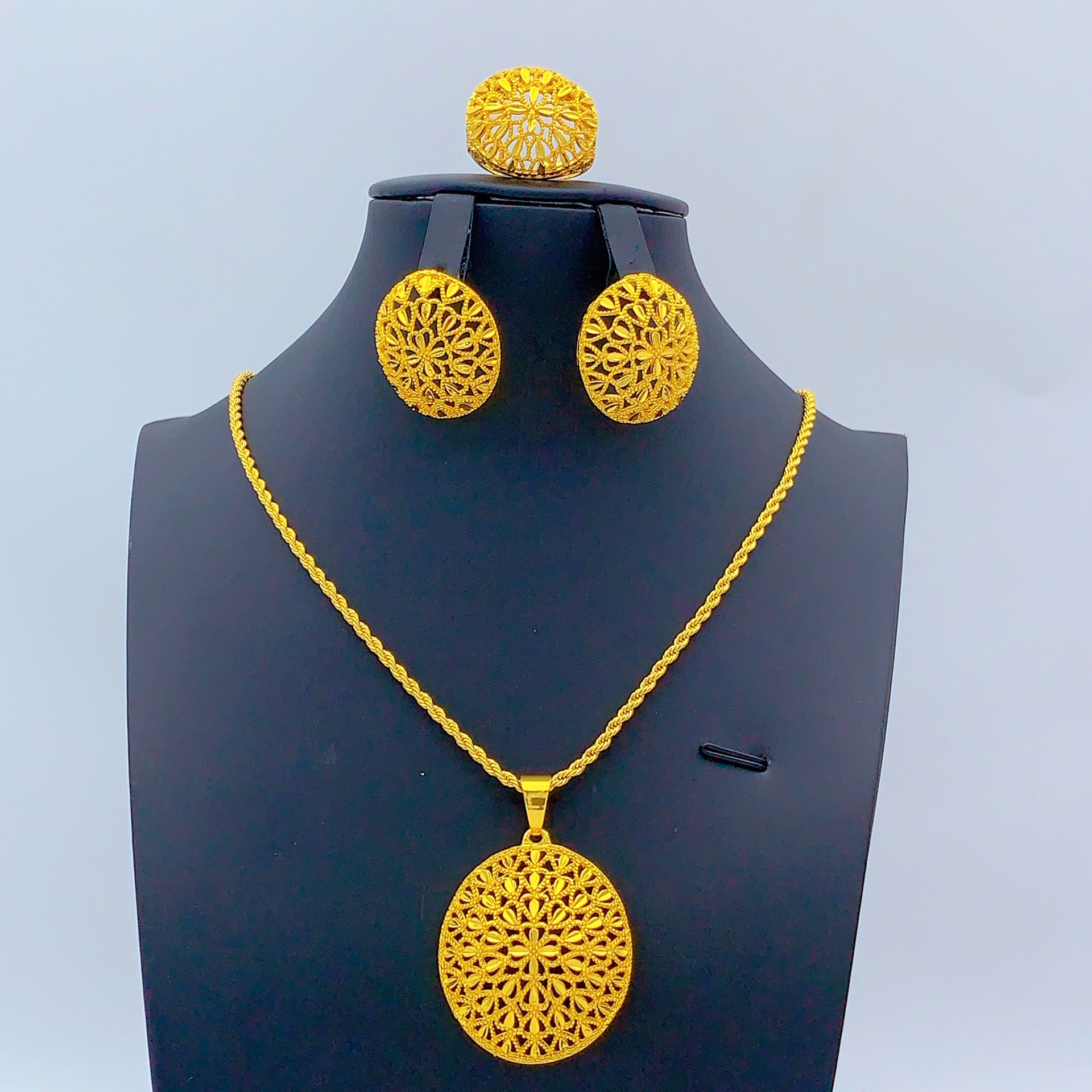 Gold-tone floral oval medallion jewelry set, front view