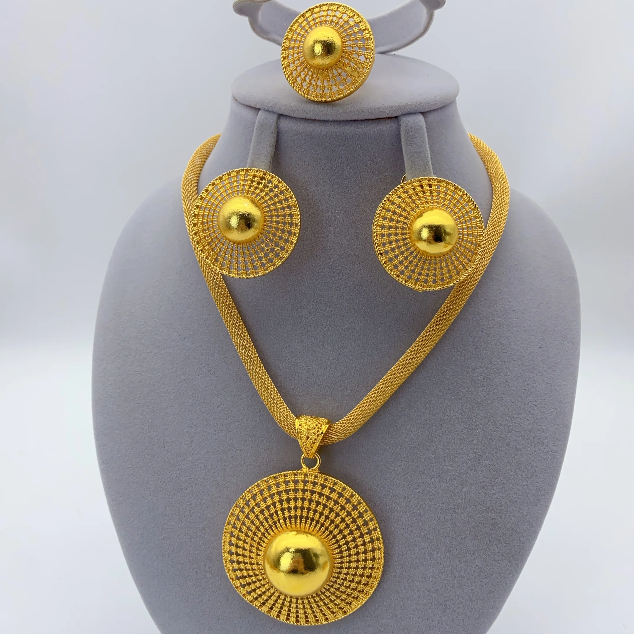 Gold-tone sunburst dome disc jewelry set, front view