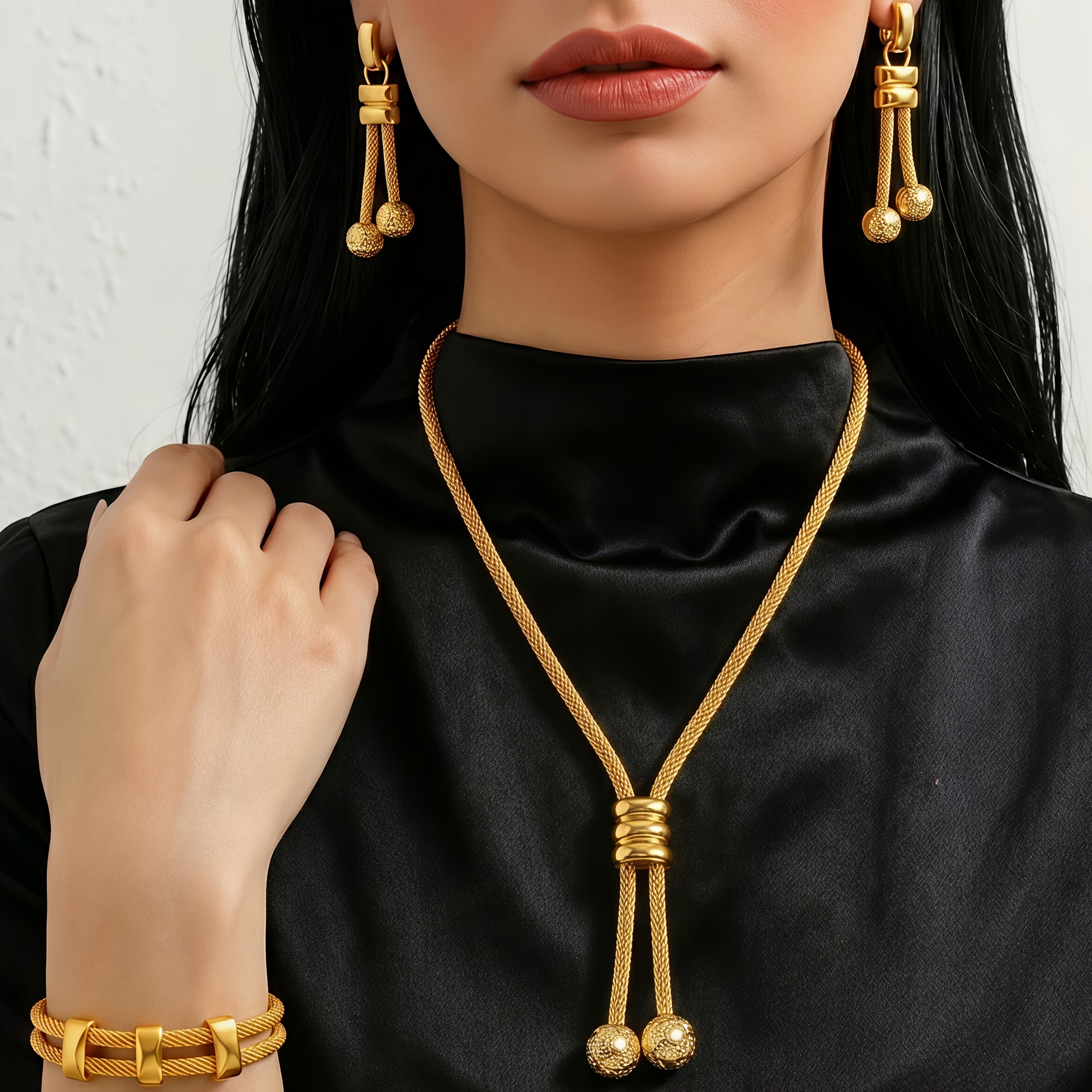 Gold-tone geometric square jewelry set, front view
