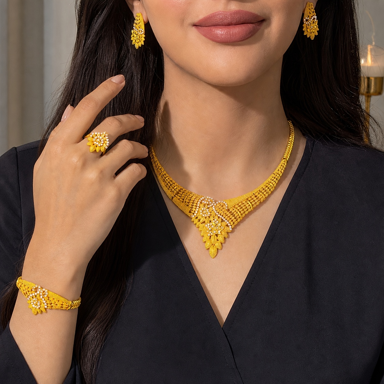 Gold-tone openwork blossom jewelry set, front view