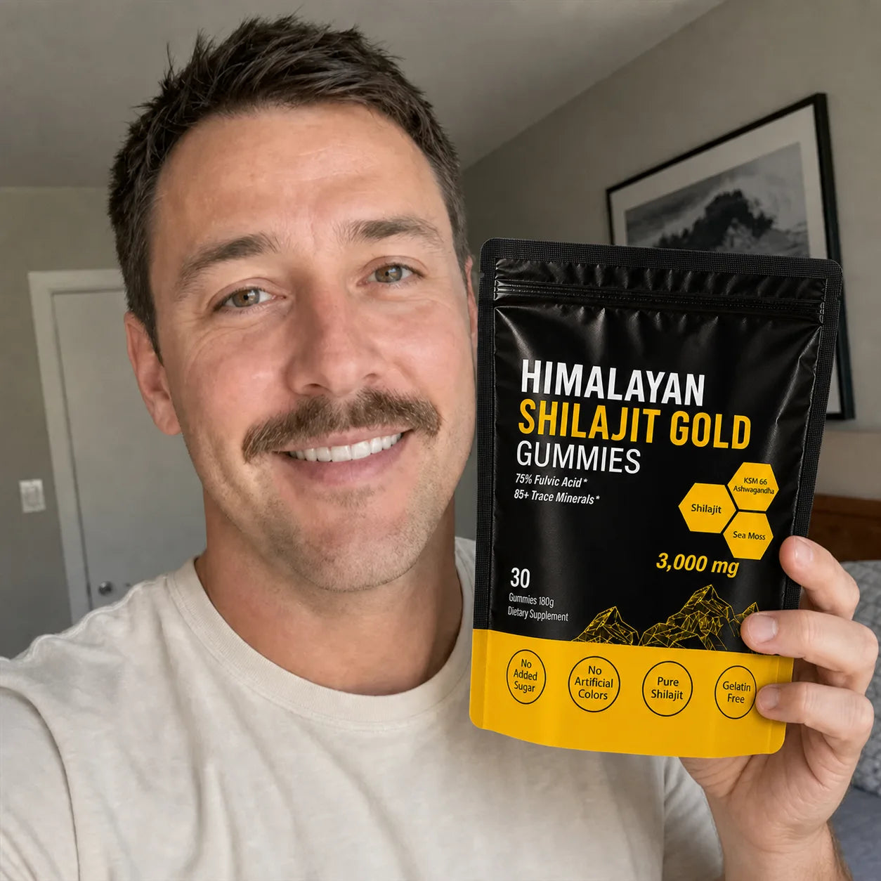 Customer holding MENRYX gummies at home