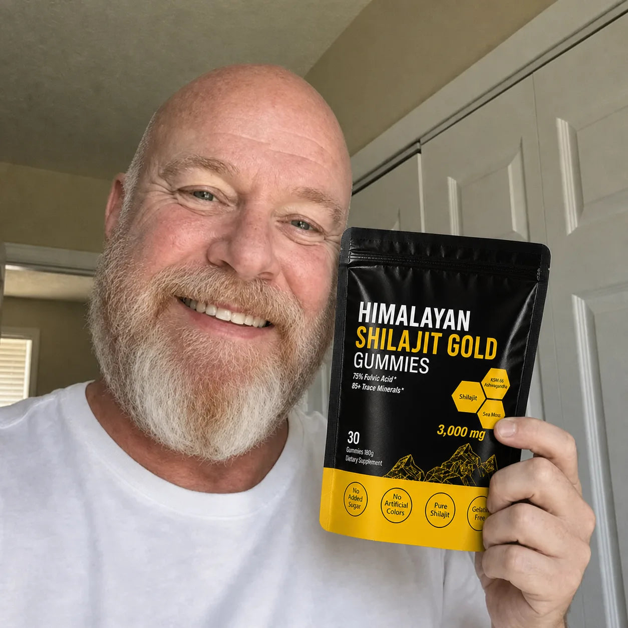 Senior customer holding MENRYX gummies at home