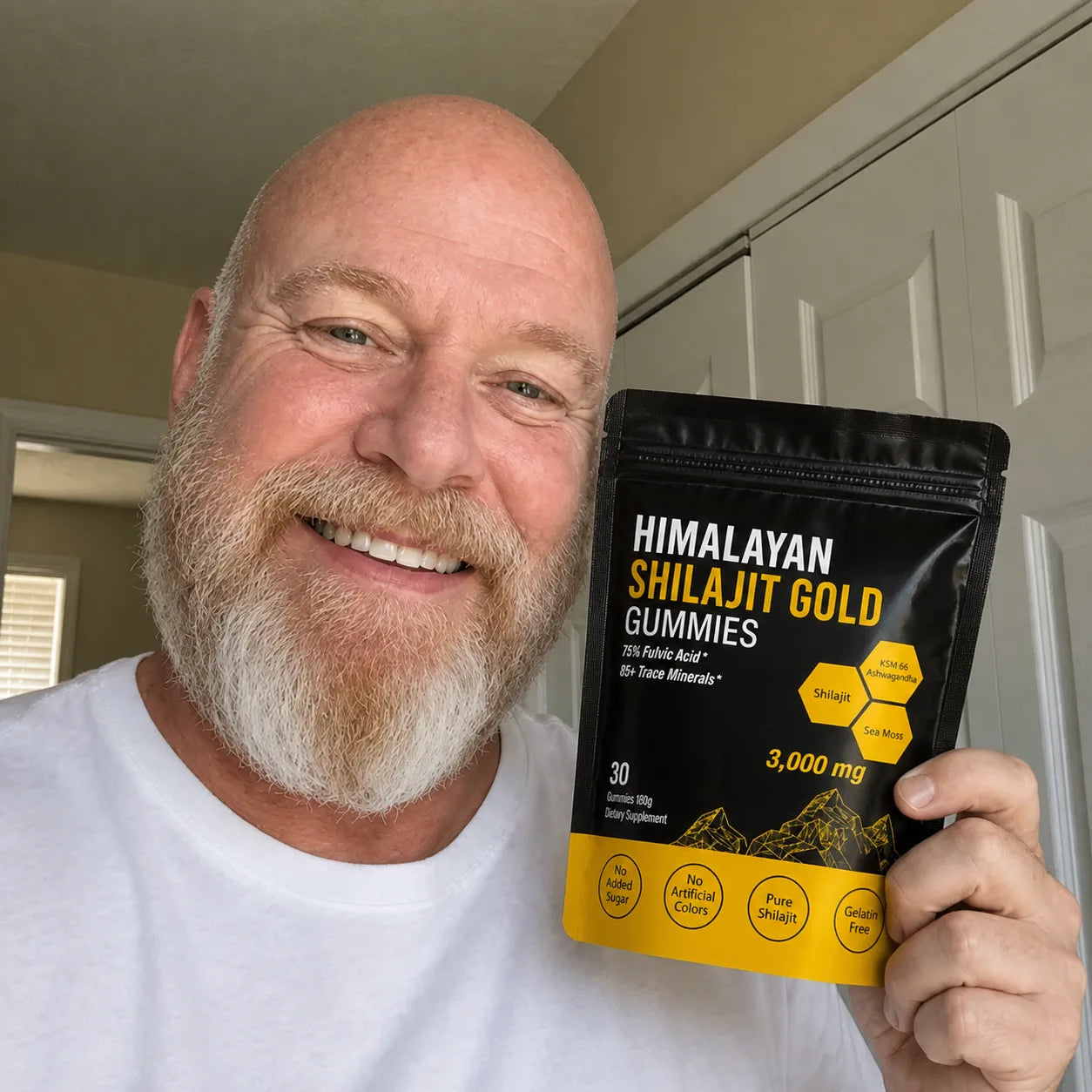 Senior customer holding MENRYX gummies at home