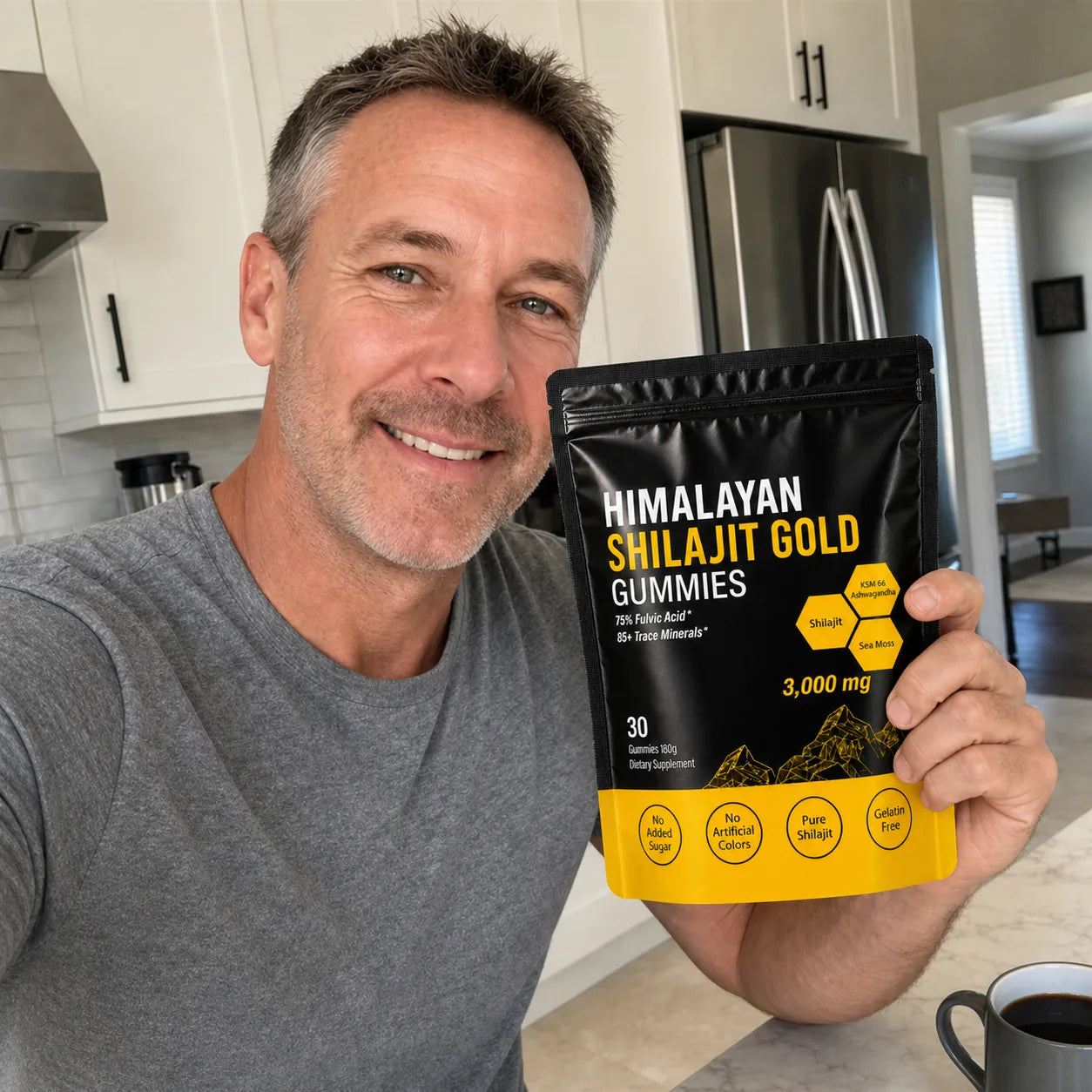 Customer holding MENRYX gummies in a bright kitchen