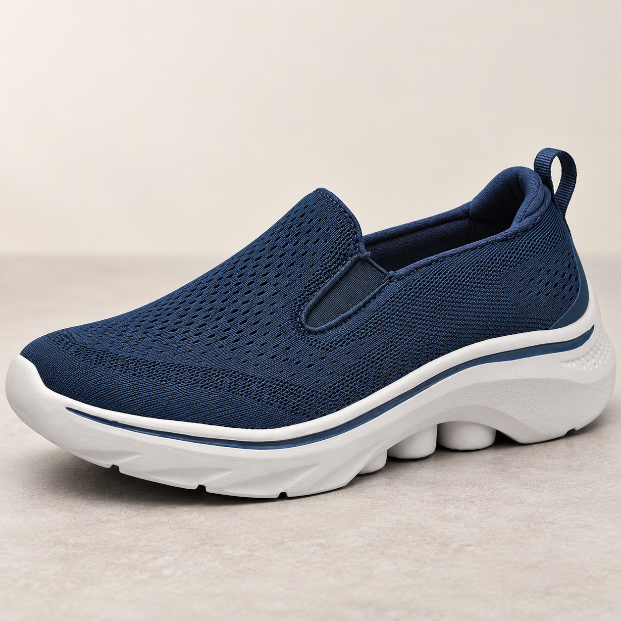 Close-up of Motion navy mesh texture, lace-free instep and elastic side gore.