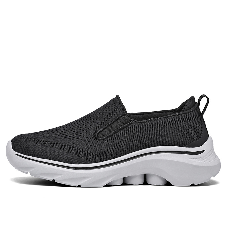 Side view of a Black Motion mesh slip-on sneaker.