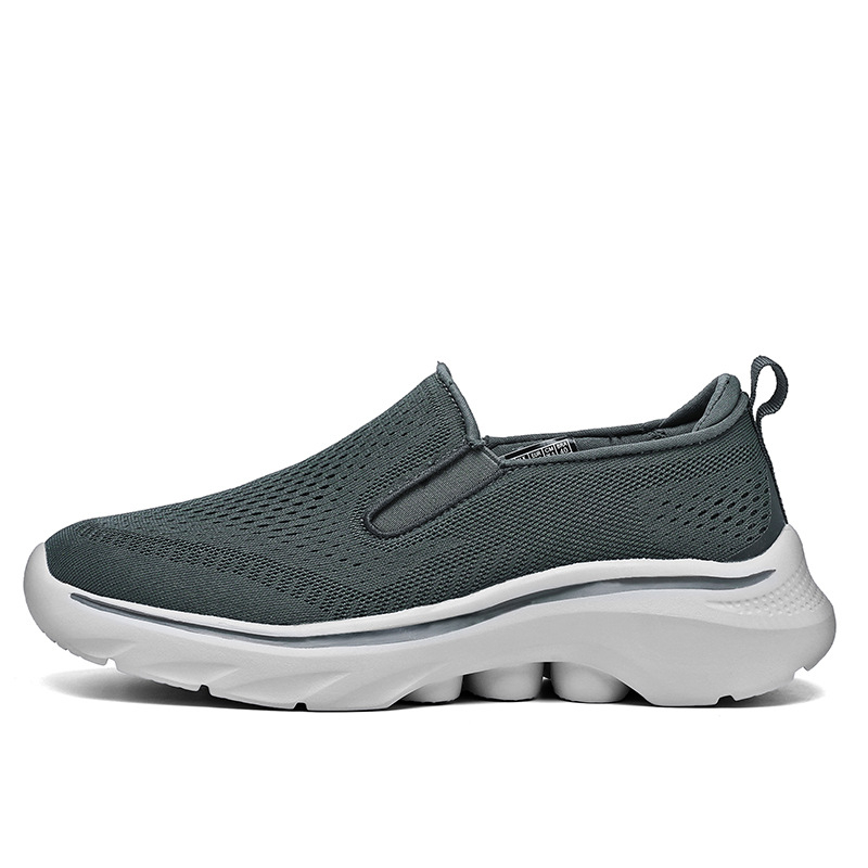 Side view of a Dark Gray Motion mesh slip-on sneaker.