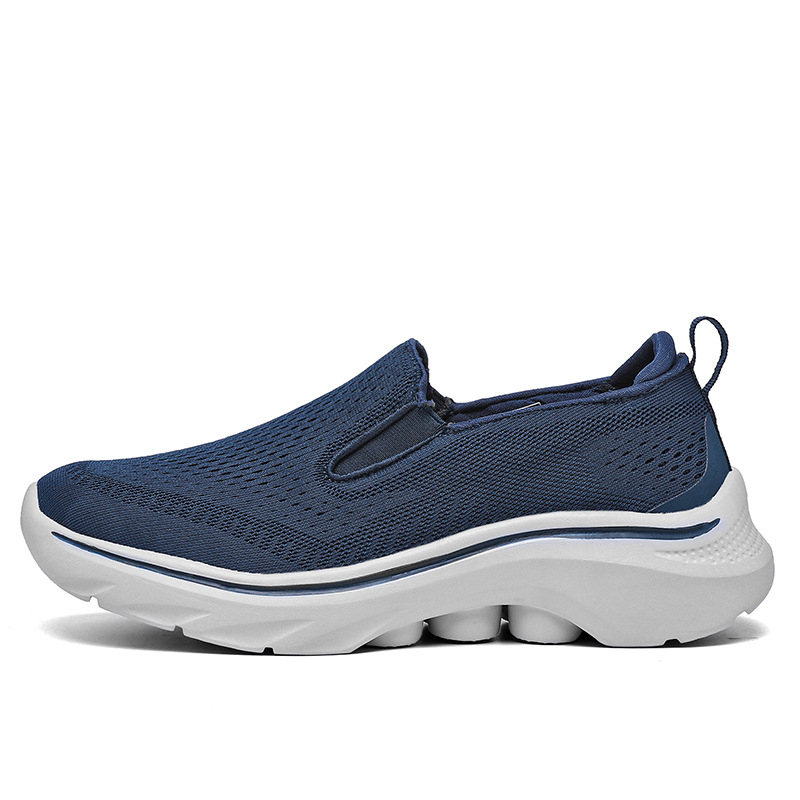 Side view of a Navy Motion mesh slip-on sneaker.