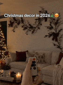 Flexible LED branch lights glowing on a holiday wall