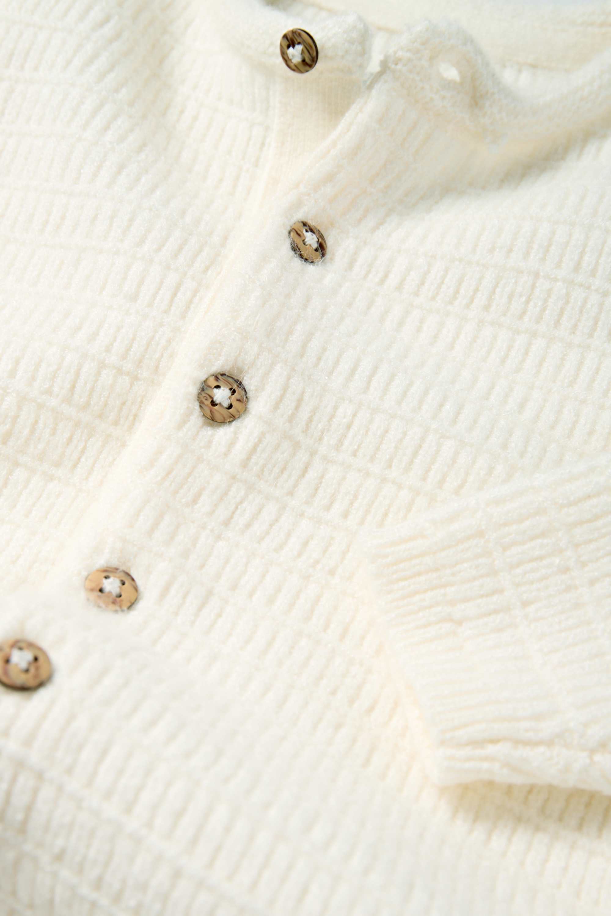 Knitted baby jumpsuit - textured white