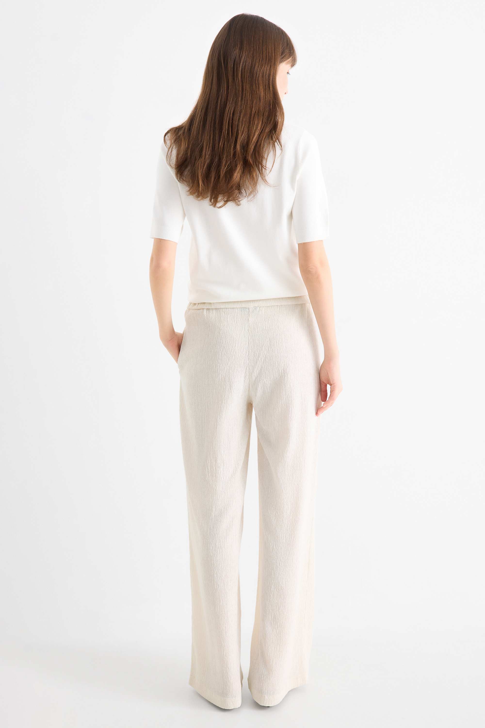 Jersey trousers - mid-rise waist - textured light beige