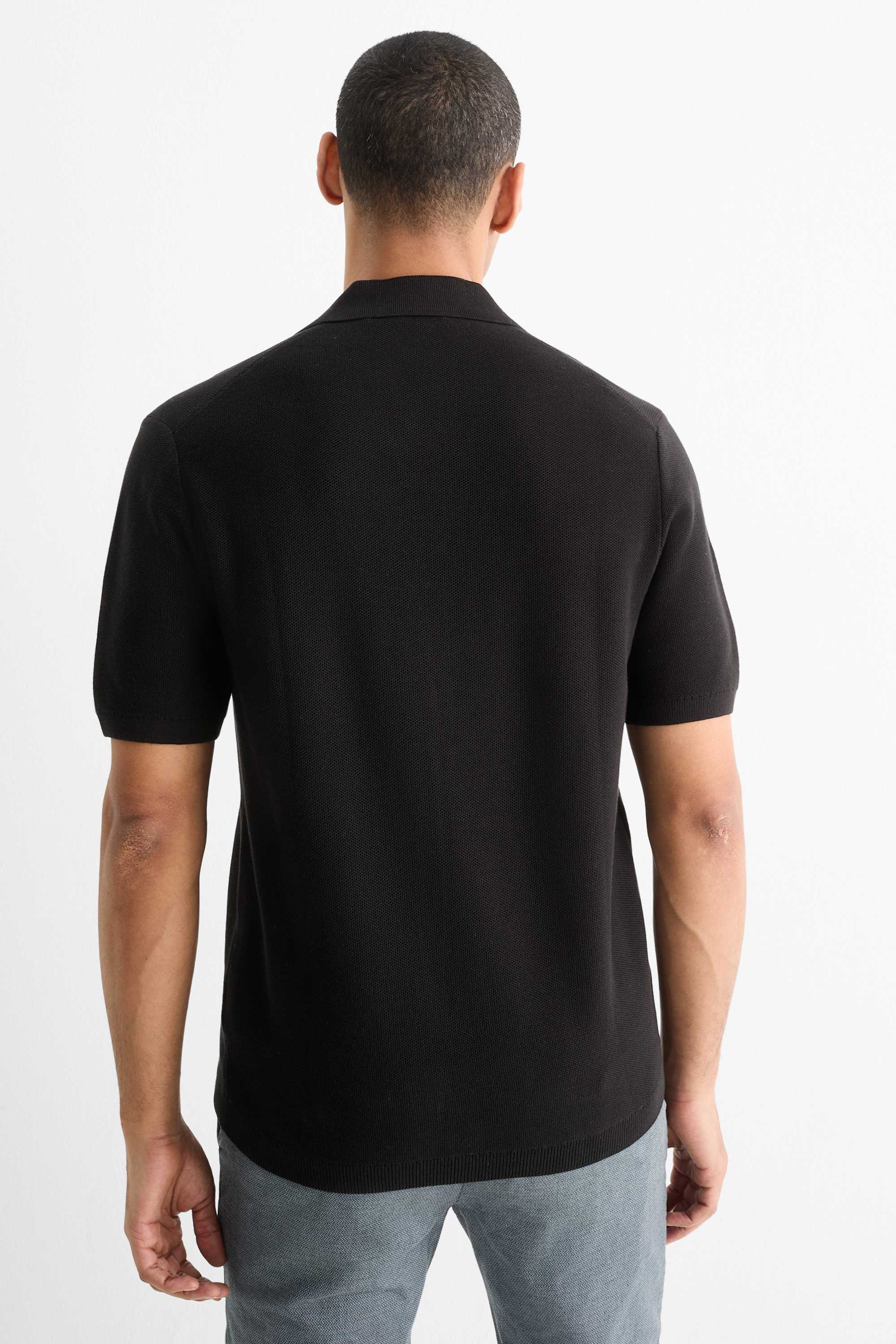 Knitted polo shirt - regular fit - textured black