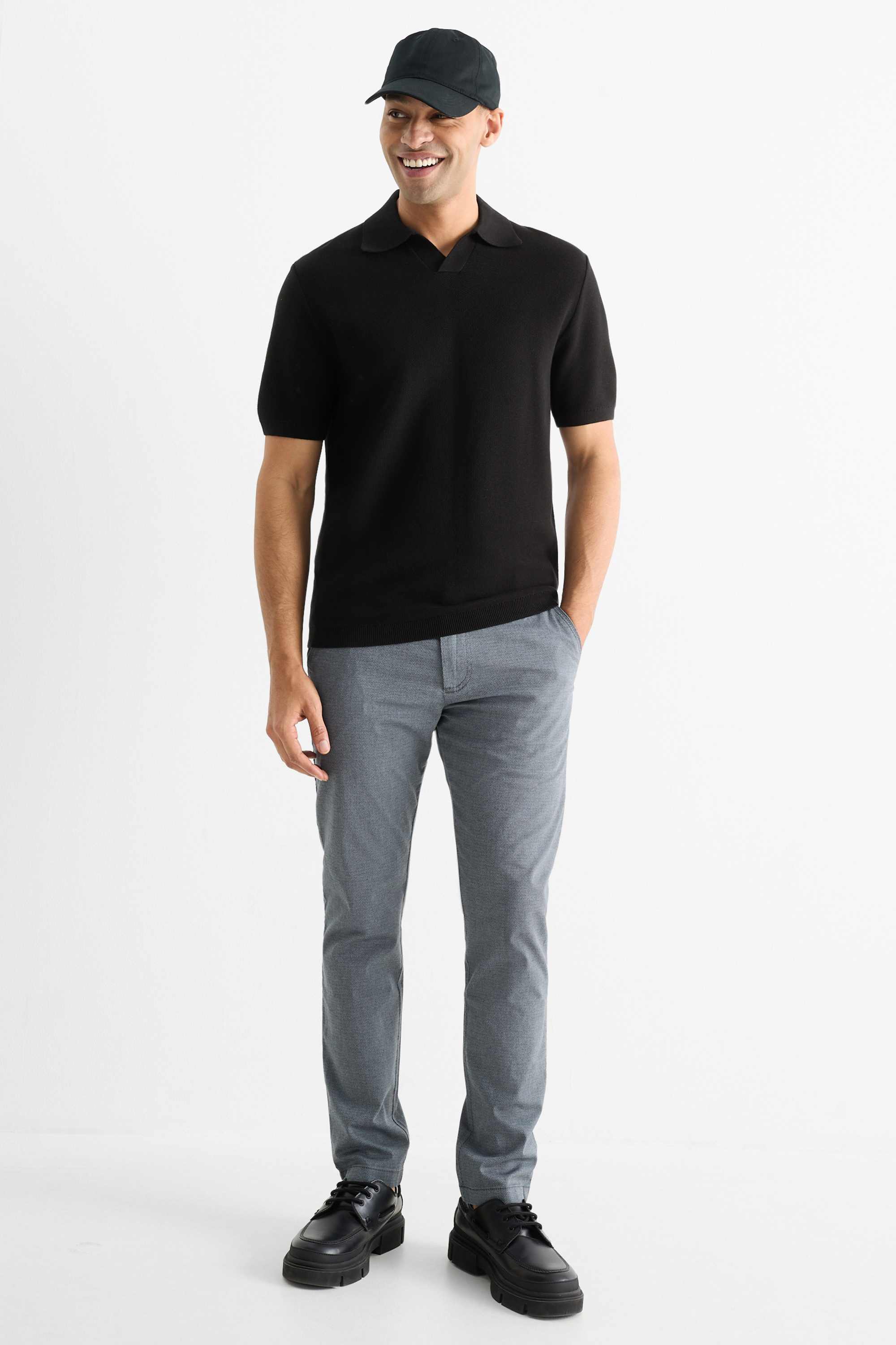 Knitted polo shirt - regular fit - textured black