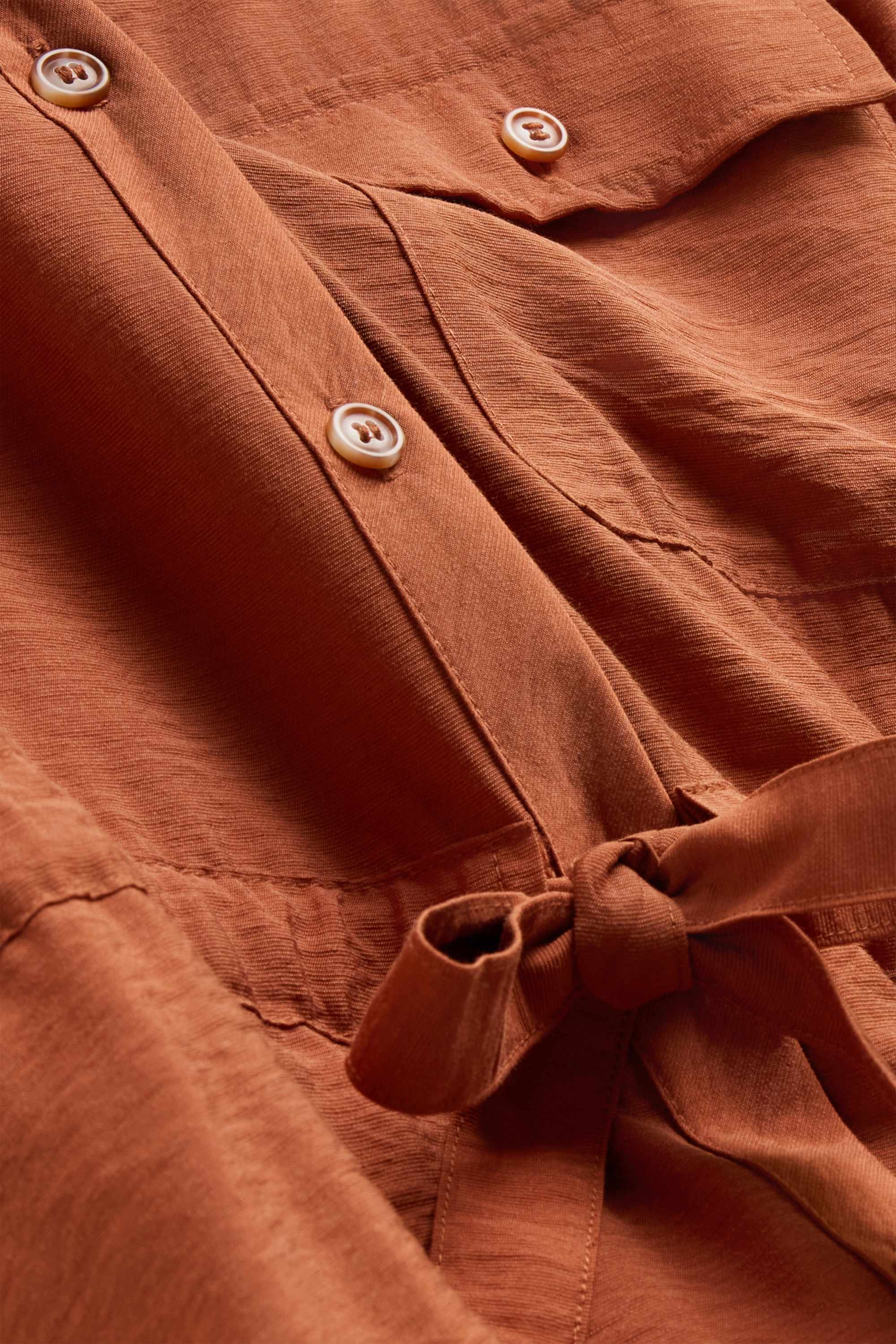 Linen blouse with knot detail and V-neck rust