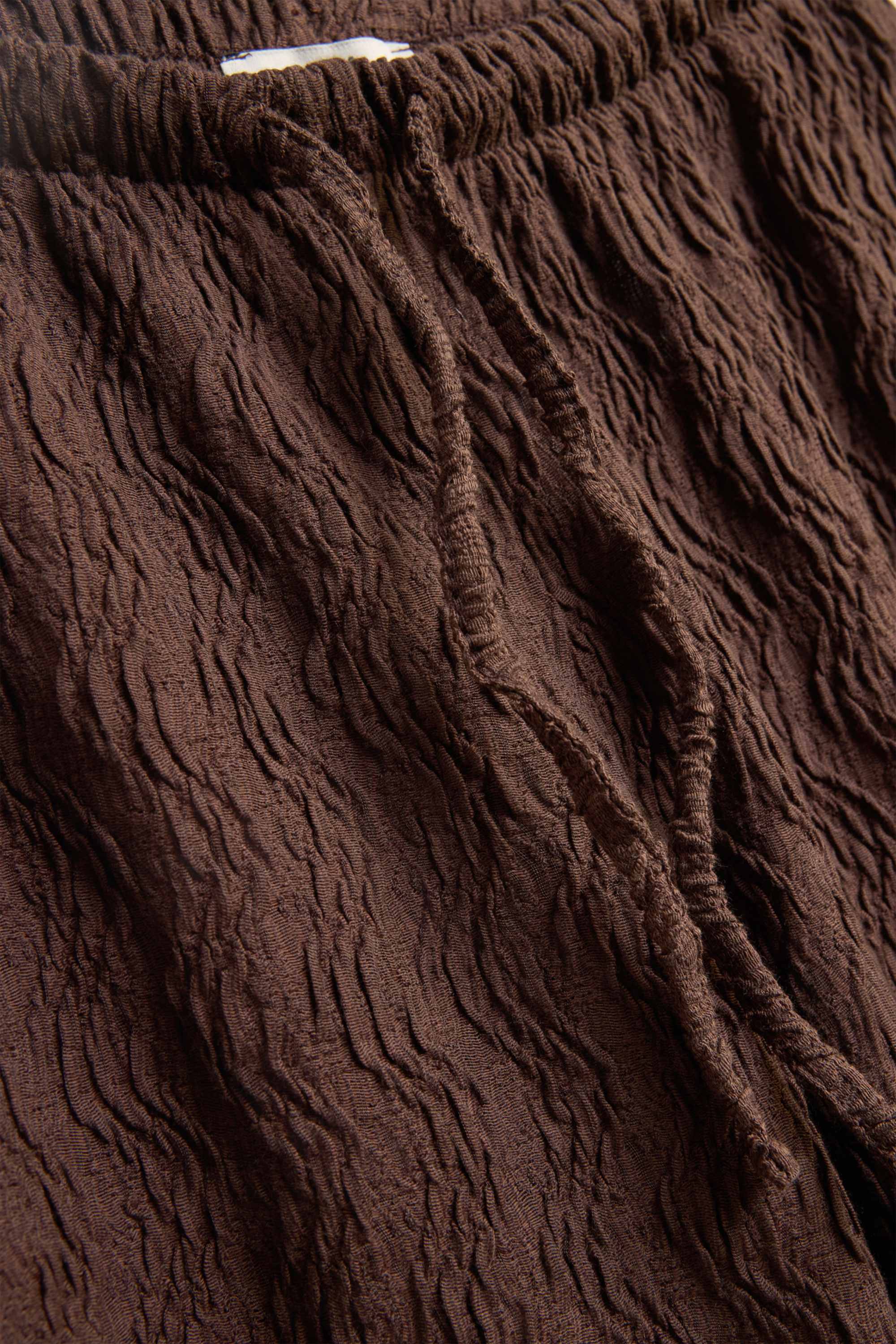 Cloth trousers - high waist - wide leg - textured brown