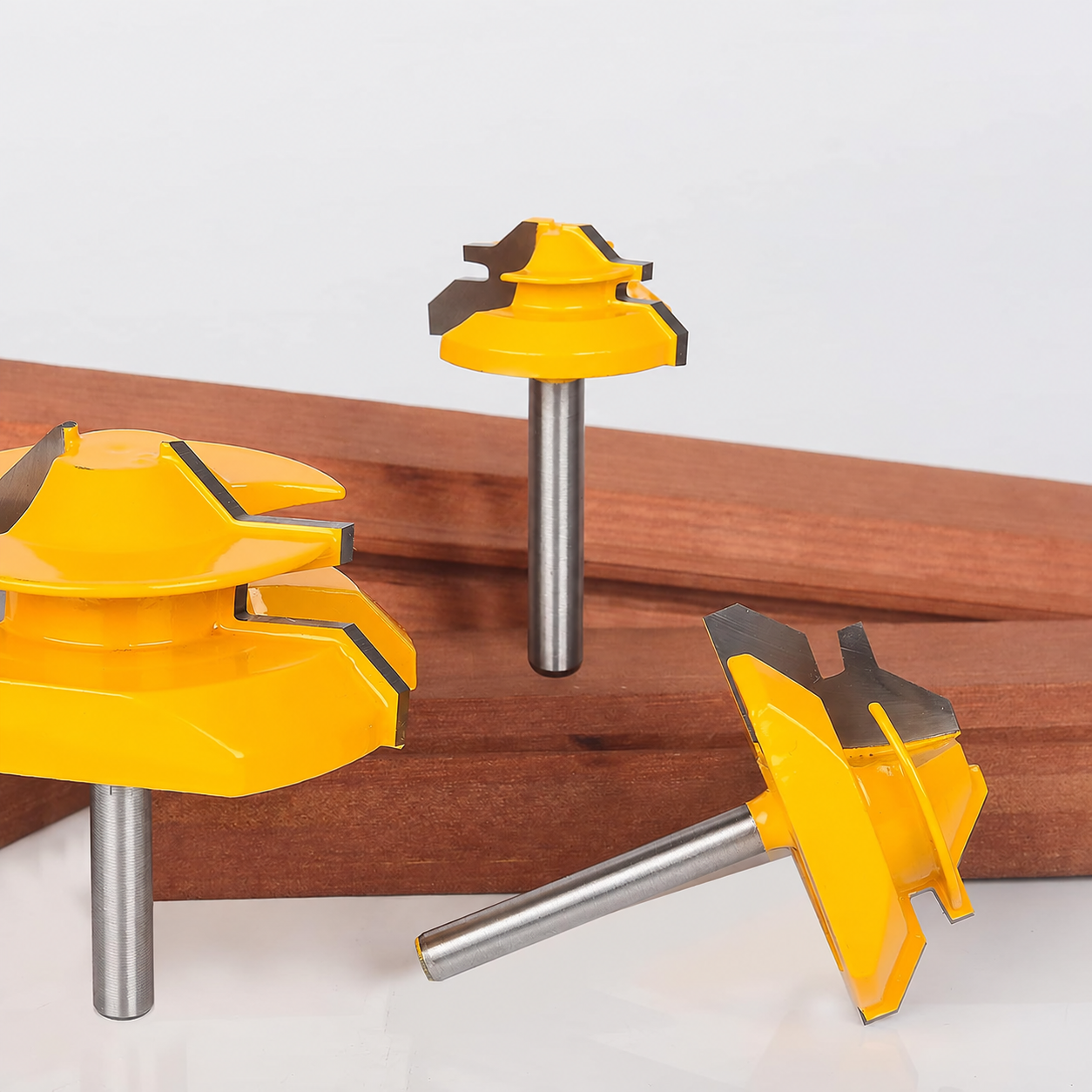 Nine-piece lock miter router bit set displayed with finished wood joints