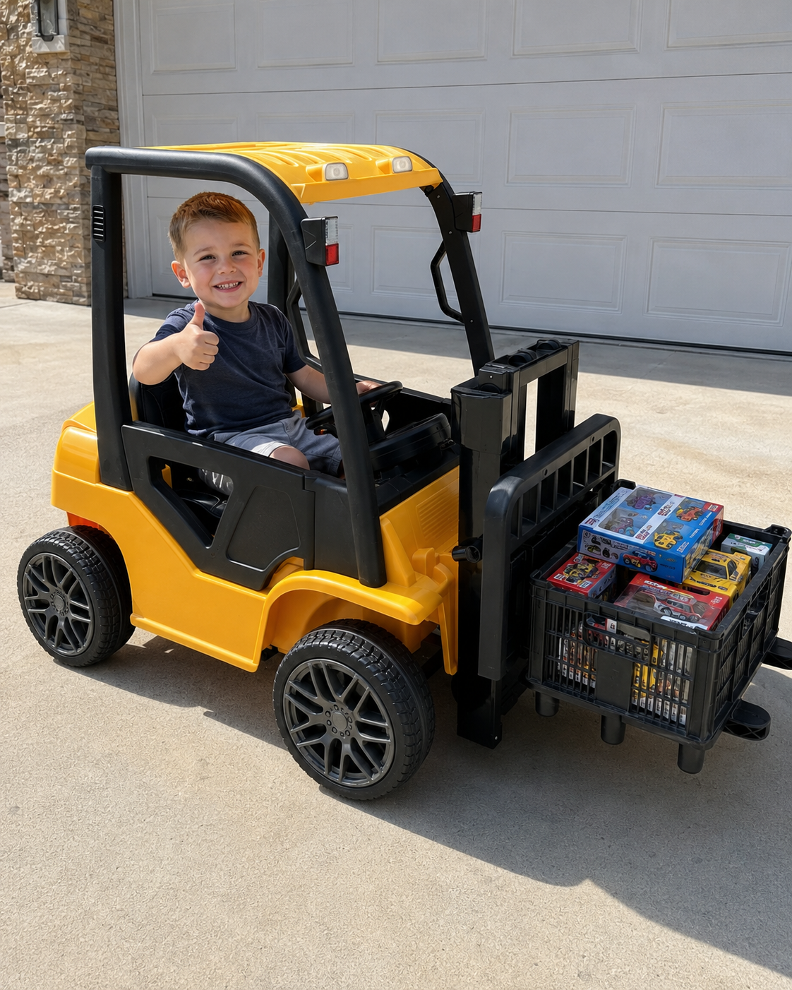 child driving a yellow electric ride on forklift outdoors