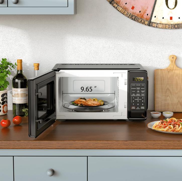 Horno microondas de encimera negro de 0,7 pies cúbicos, 700 vatios, diseño compacto, ideal para cocinar y hornear.