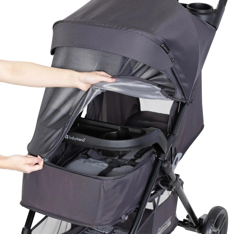Cochecito con cabina Comfort Cabin, capota con cremallera completa para protección solar y cesta de almacenamiento grande.