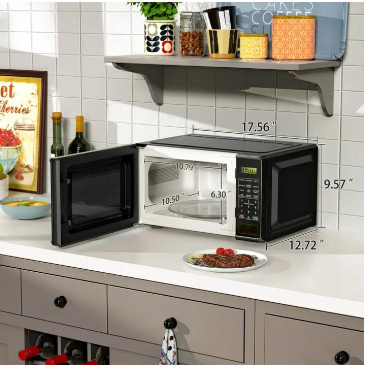 Horno microondas de encimera negro de 0,7 pies cúbicos, 700 vatios, diseño compacto, ideal para cocinar y hornear.