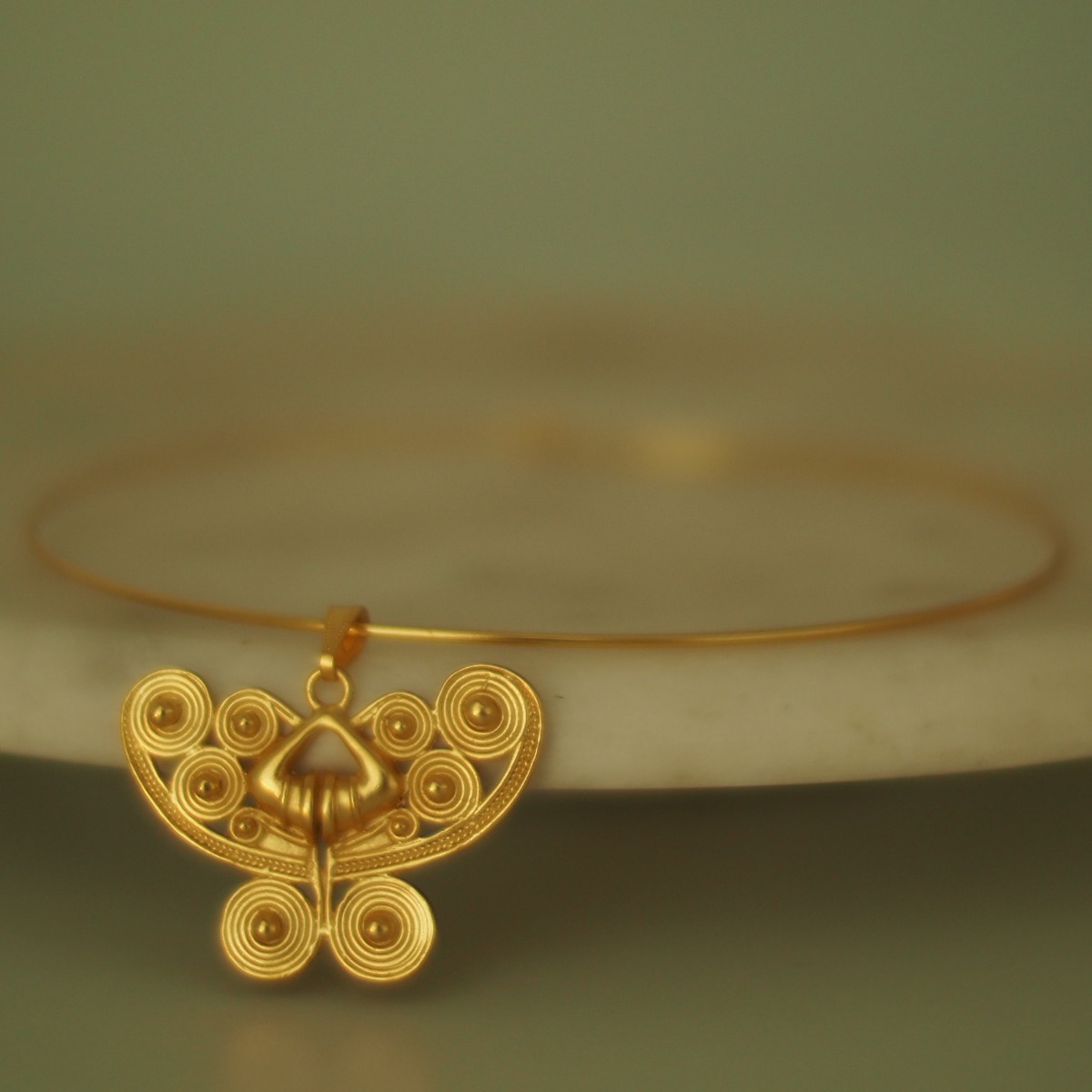 Across The Puddle, Historical Jewelry Collection, 24k Gold Plated Omega Choker Necklace with a Pre-Columbian Spirals Butterfly Pendant