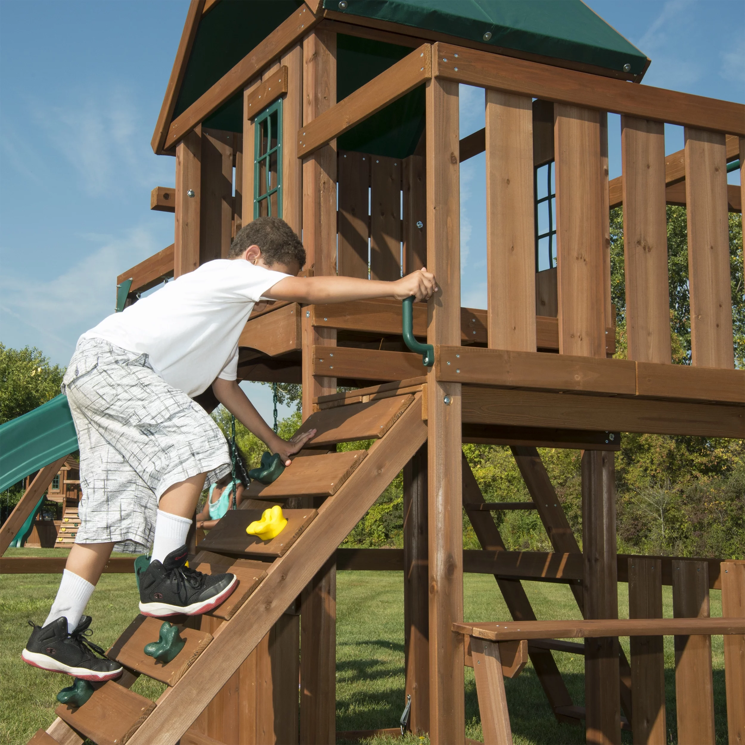 Swing-N-Slide Knightsbridge Wooden Backyard Swing Set with Alpine Wave Slide, Glider Swing, and Rock Climbing Wall