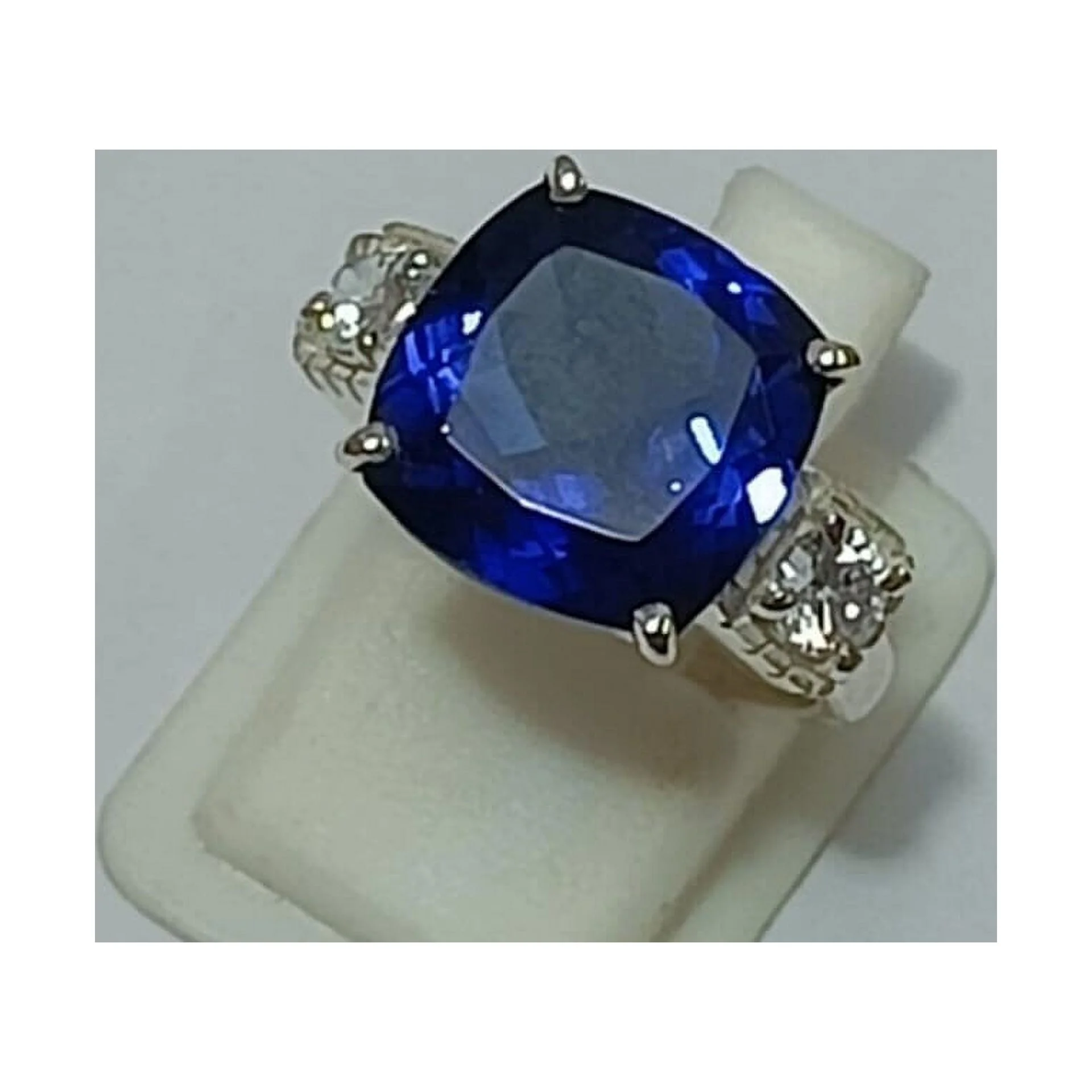3 carat elongated cushion lab-created blue sapphire with two flanking Blue White Sapphire Elongated Cushion Engagement Ring