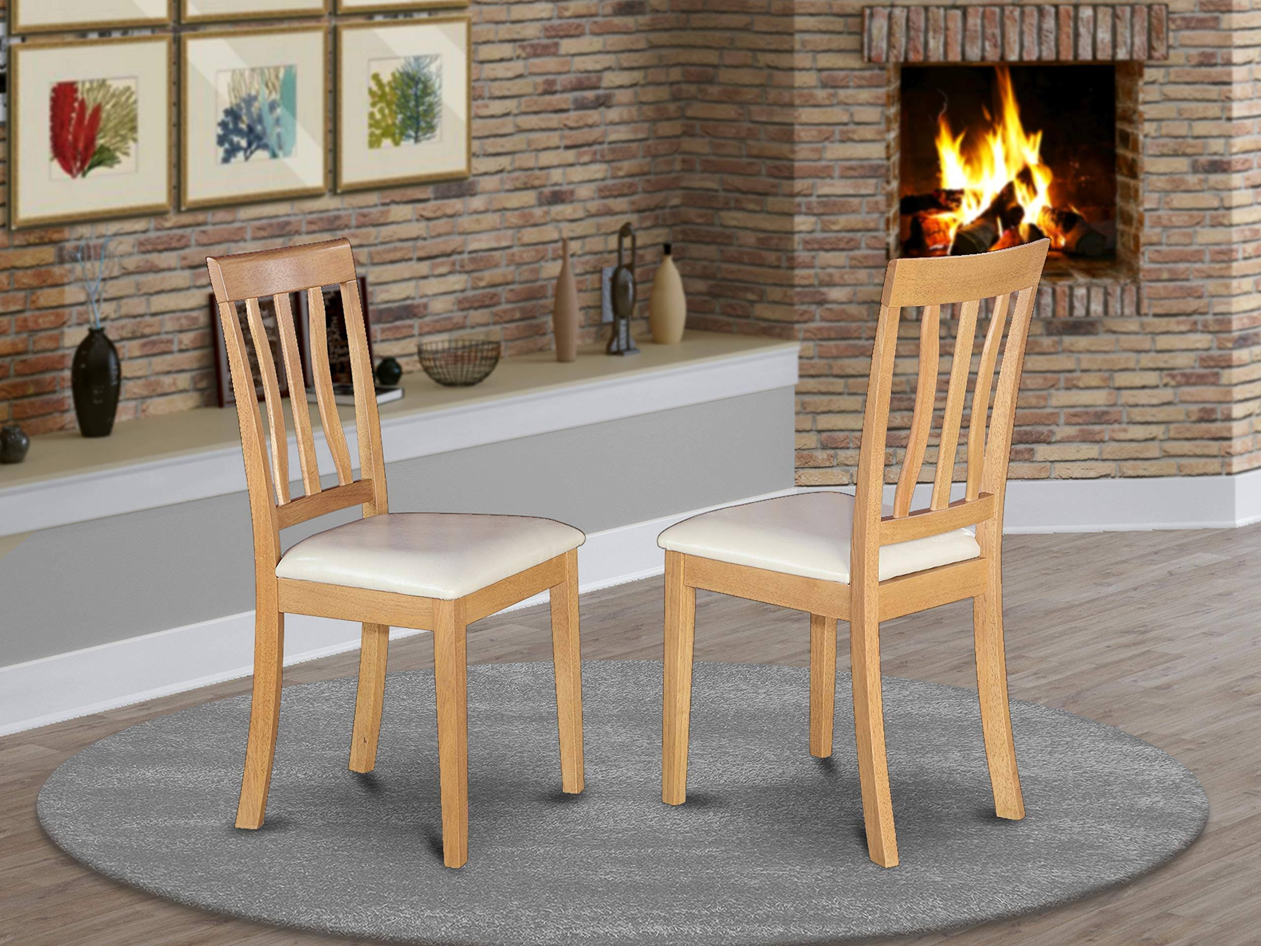 East West Furniture Antique Dining Chair with Faux Leather Seat in Oak Finish - Set of 2 - Anc-oak-lc