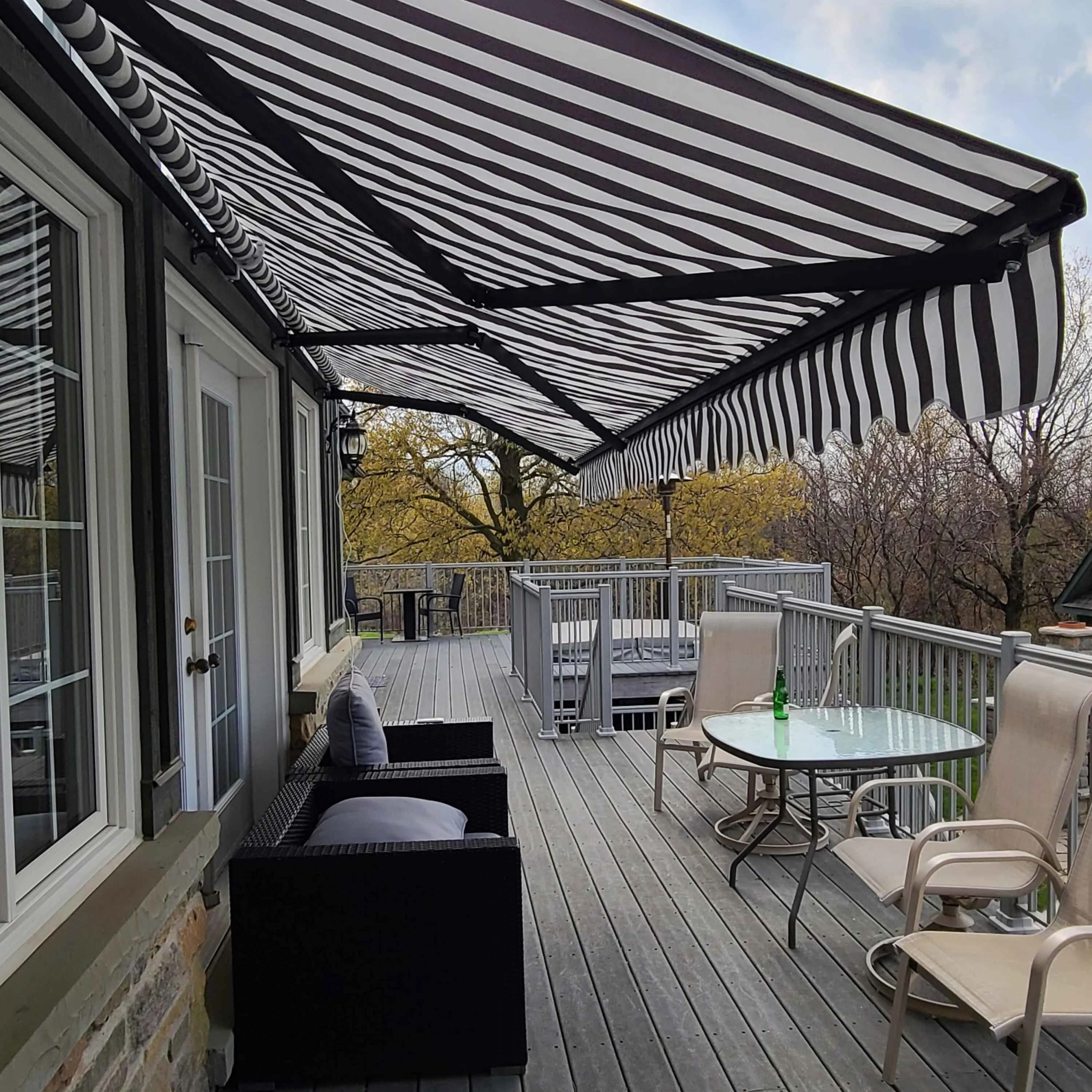 ALEKO 20' x 10' Retractable Motorized Black Frame Patio Awning, Gray and White Striped Color
