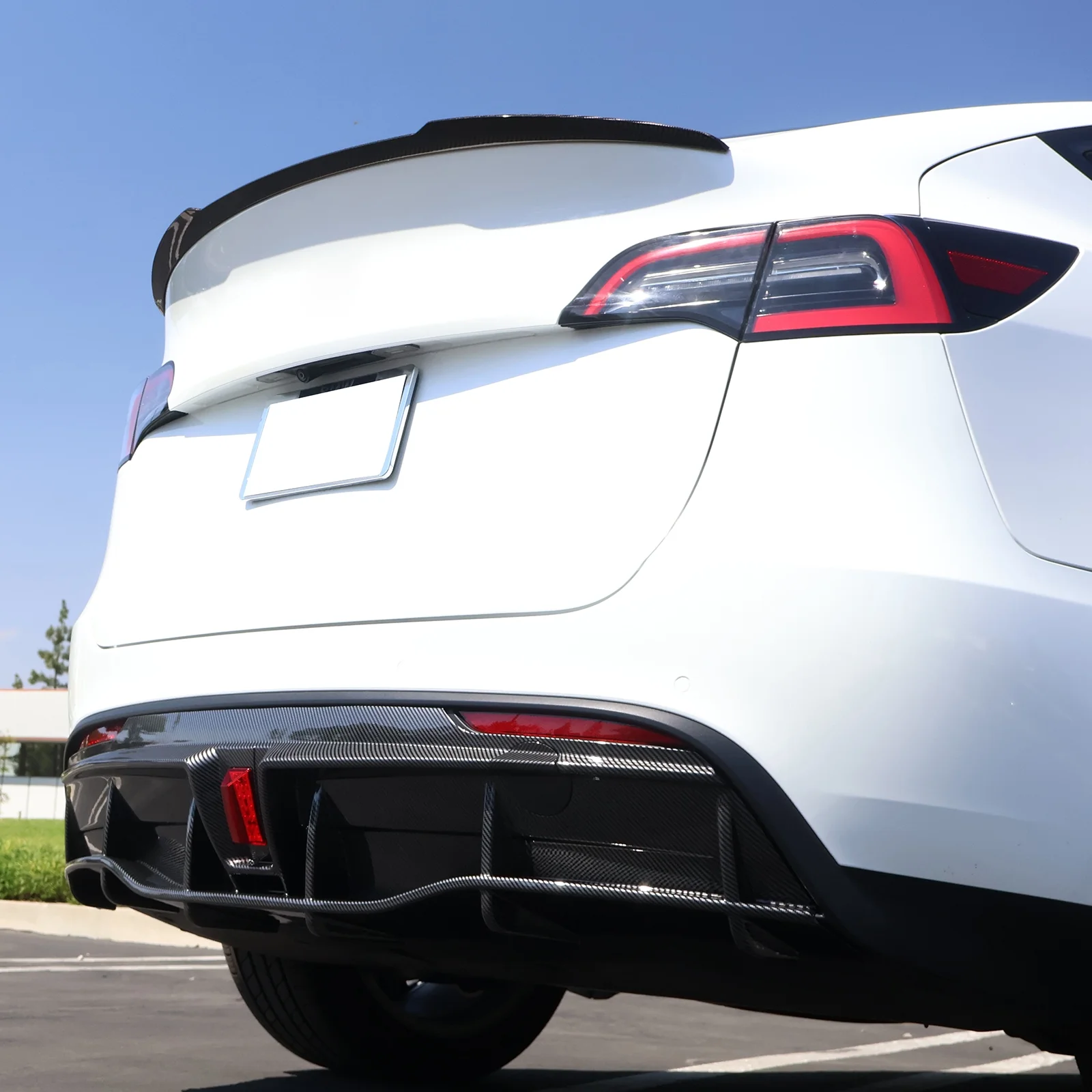 Ikon Motorsports Rear Diffuser Lip Compatible With 2020-2023 Tesla Model Y Sport 4-Door Carbon Fiber Print IKON Style PP Rear Lower Bumper Protector Lip With LED Lamp