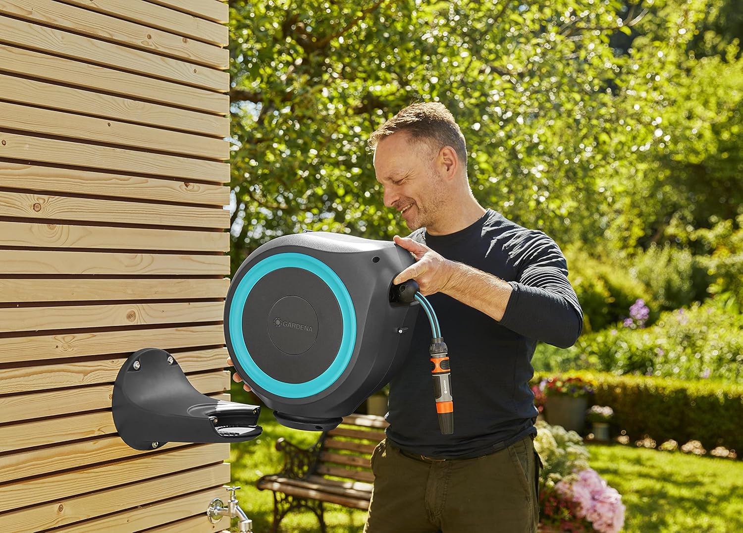 Gardena Wall Mounted Retractable hose reel. 65 Ft with Automatic Rewind, 180 Degree Swivel Bracket and any Length hose Lock. Made in Europe