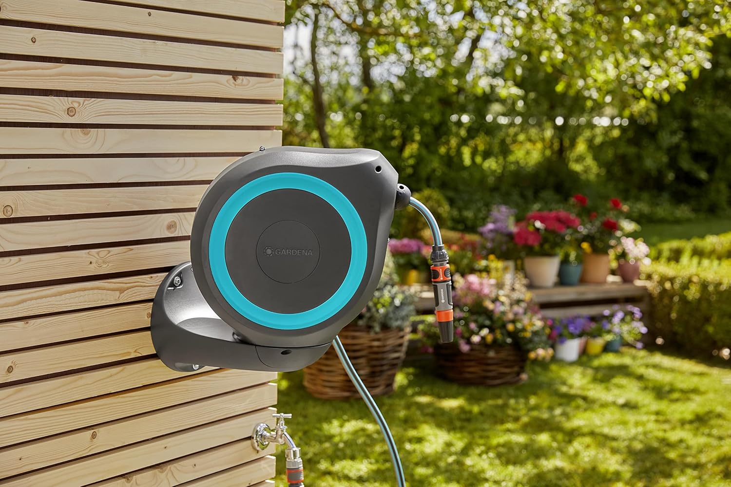 Gardena Wall Mounted Retractable hose reel. 65 Ft with Automatic Rewind, 180 Degree Swivel Bracket and any Length hose Lock. Made in Europe