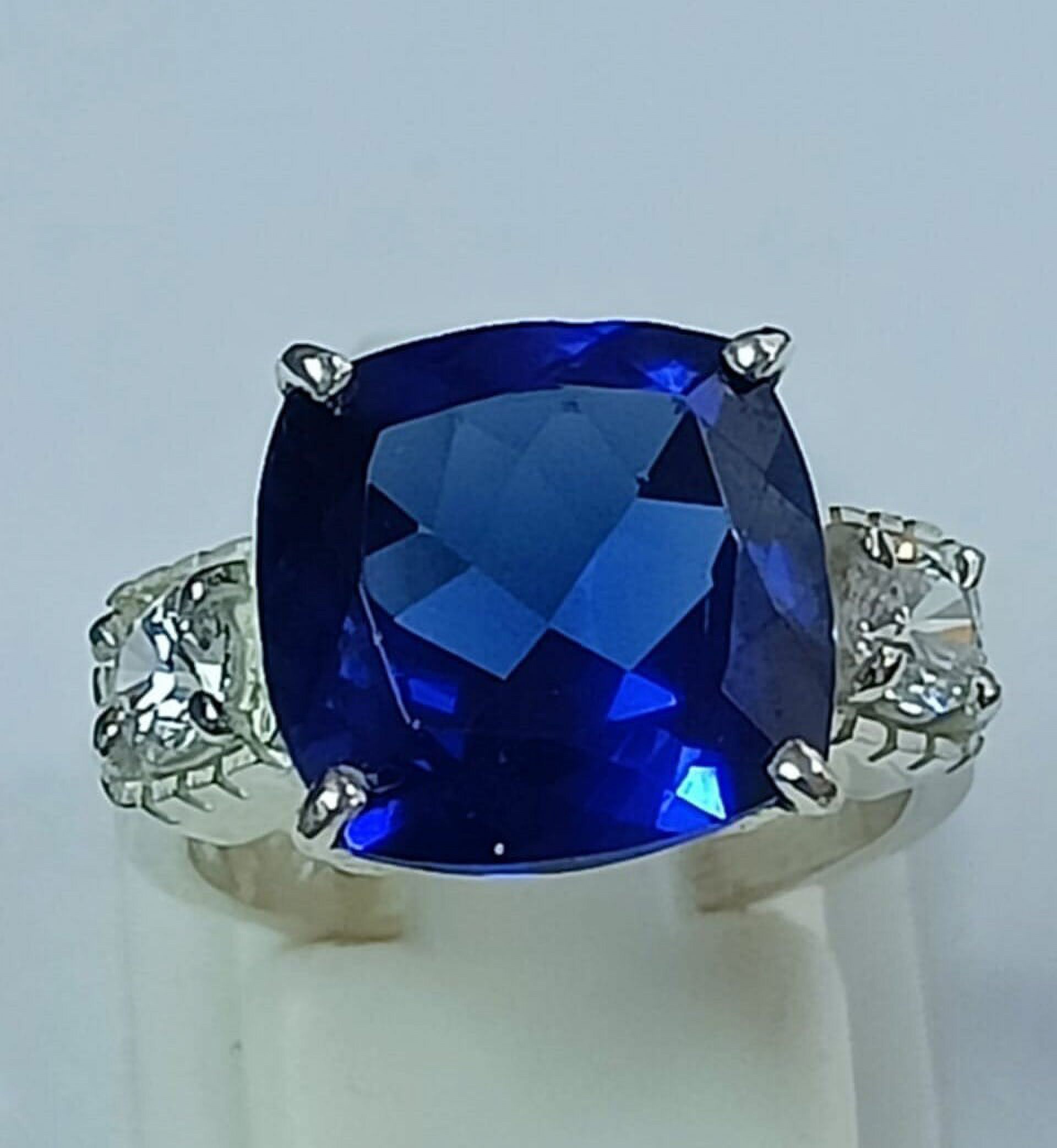 3 carat elongated cushion lab-created blue sapphire with two flanking Blue White Sapphire Elongated Cushion Engagement Ring