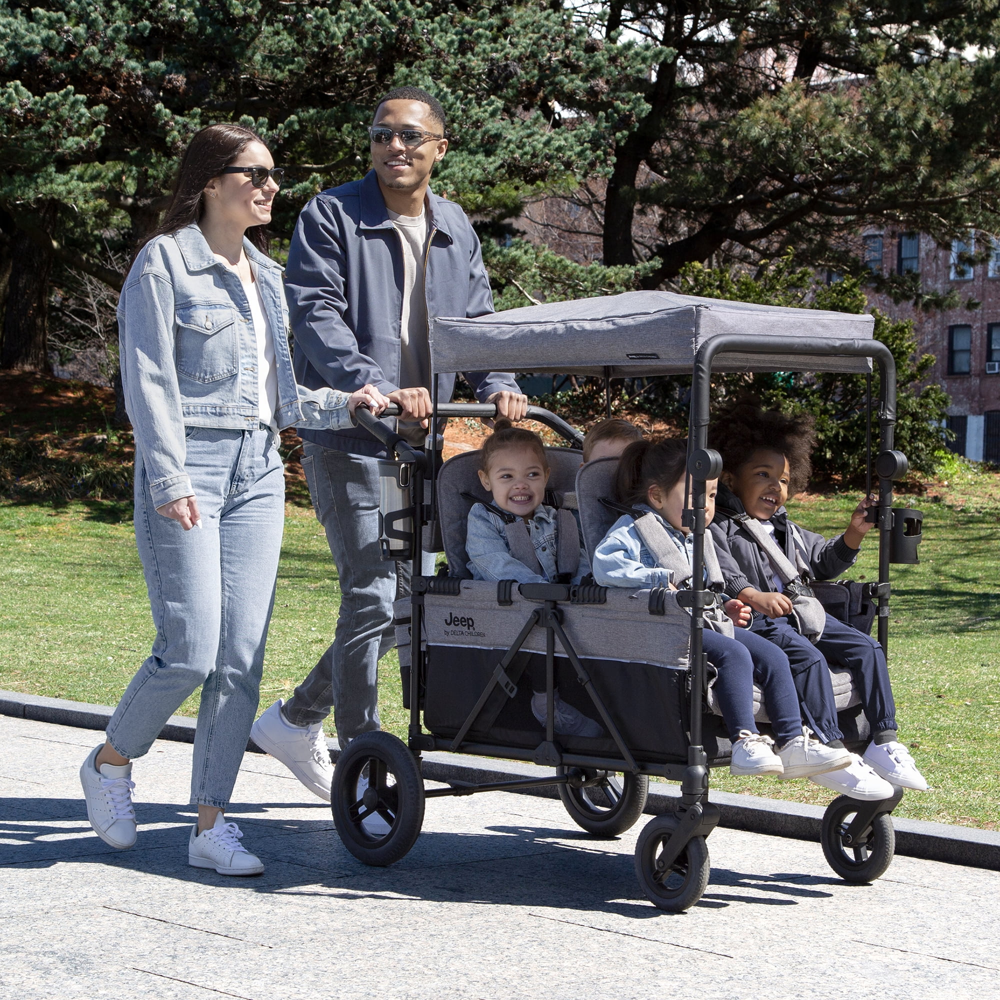 Jeep Wrangler Deluxe 4 Seater Stroller Wagon by Delta Children - Premium Quad Stroller Wagon for 4 Kids with Convertible Seats, Adjustable Push/Pull Handles, Removable Canopy & Flat Fold, Grey