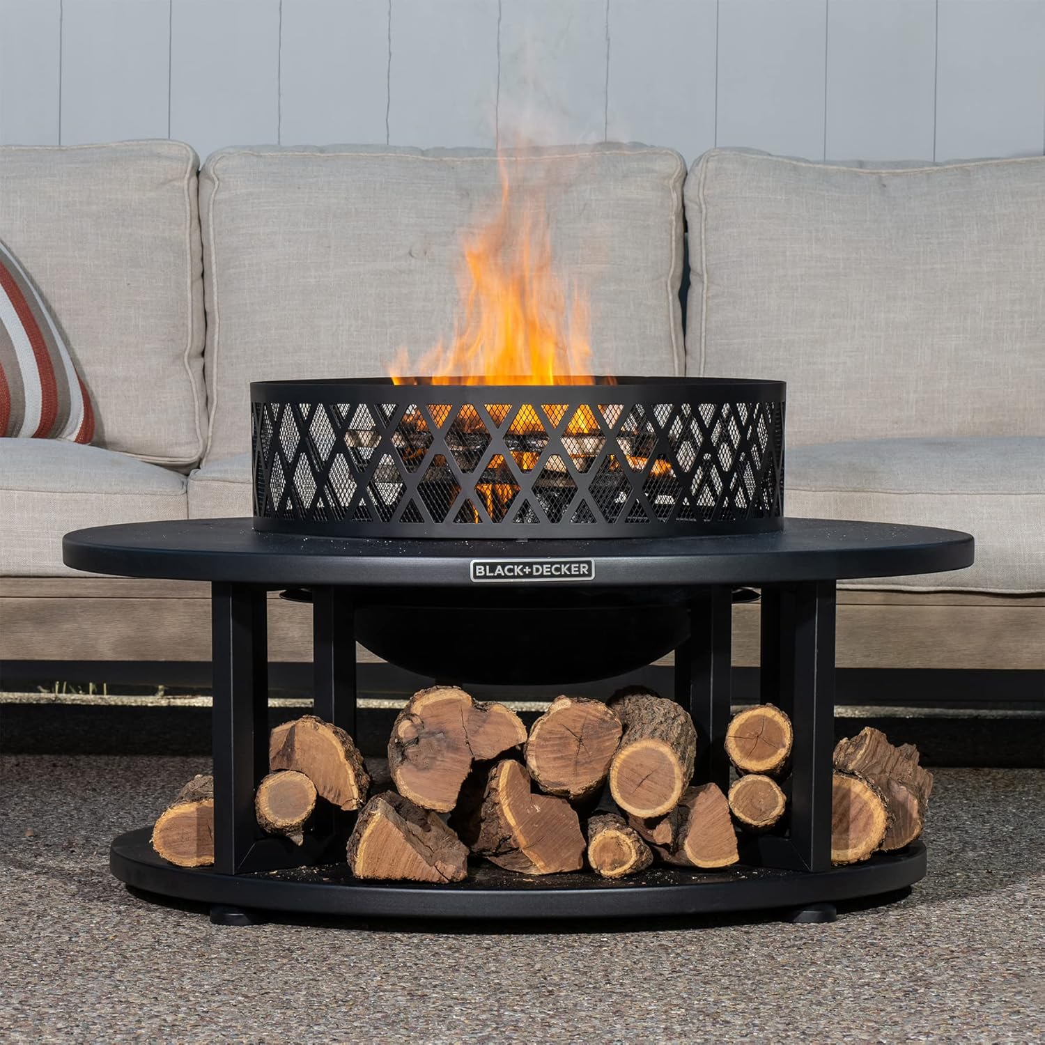 BLACK + DECKER 38" D Steel Wood burning fire pit with log storage area for entertaining backyard bonfires includes mesh lid and poker Black powder coated steel
